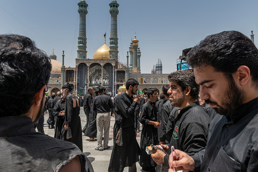 Qom- Iran. -may 14,2013: Shiite muslims practice self-flagellation in the courtyard of the Fatima Masumeh shrine. Fatima Masumeh shrine is an important center of religion for sii sect.