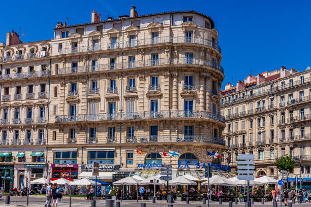 City life with locals and tourists in Quai du Port, in the harbor quay of Marseille.
