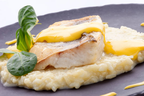 istock roasted fillet of cod on a bed of risotto 1216195060