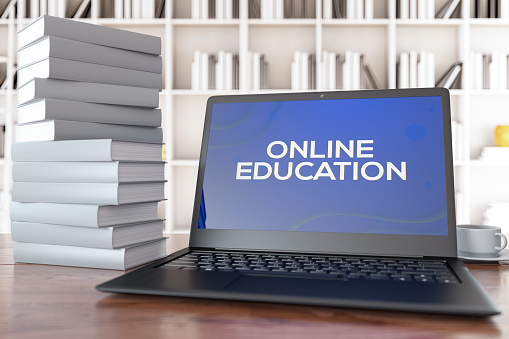 Online Education E-Learning Concept with Laptop and Books. 3d Render