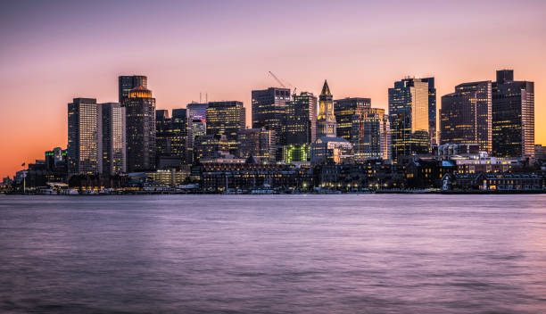 istock Panoramic Night Cityscape Boston Skyline over Boston Harbor in Massachusetts 1216195739