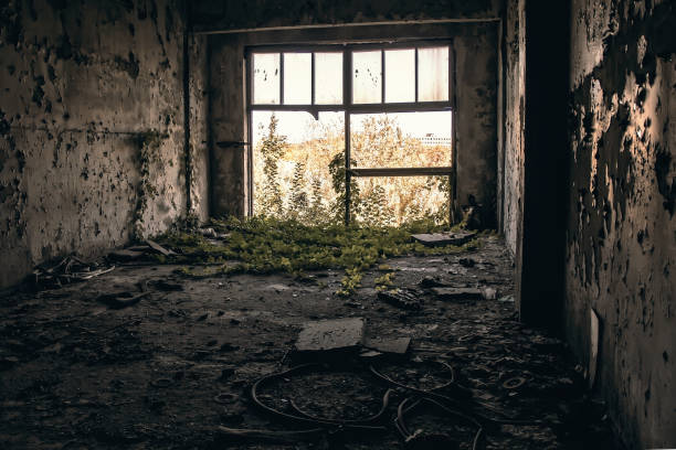 istock A large broken window in an old destroyed building. Old ruined haunted house, abandoned house. The lost city of Pripyat. Chernobyl - image 1216197072