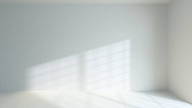 istock sunlight filtering through the window frame on the wall and on the floor realistic background 3D rendering 1216197493