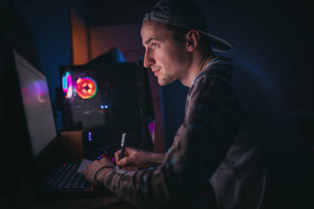 Young businessman in pajamas working from home because of pandemic of coronary virus