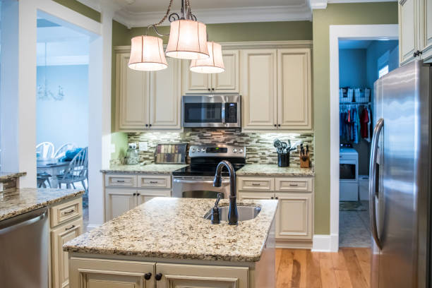 istock A small appliance microwave in a green kitchen with cream colored cabinets in a new construction home with granite countertops and lots of cabinets and storage space 1216197892