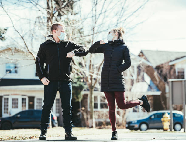 istock COVID-19, Young couple meeting outside 1216200071