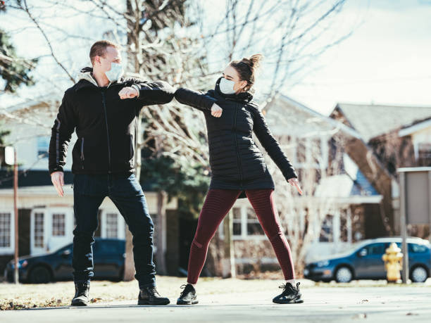 istock COVID-19, Young couple meeting outside 1216201014
