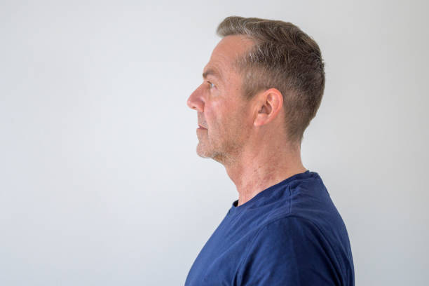 istock Profile view of an unshaven middle-aged man 1216201493