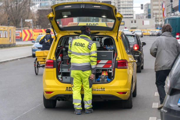 Adac yellow angels Berlin, Germany - March 31, 2020: Adac Straßenwacht. The ADAC (General German Automobile Club) operates through mobile mechanics in yellow cars that assist motorists in trouble - the Yellow Angels adac stock pictures, royalty-free photos & images