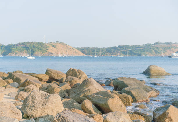 Sea view of a large stone terrace with yachts, Phuket beach