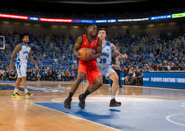 istock Basketball players tackling for ball 1216206164