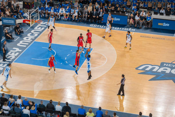 istock Basketball players chasing for ball 1216206258
