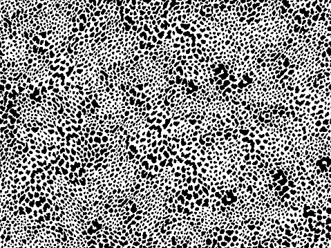 Detailed animal print seamless pattern with black spots on white background. Hand drawn animal print for fashion, textile, interior design.