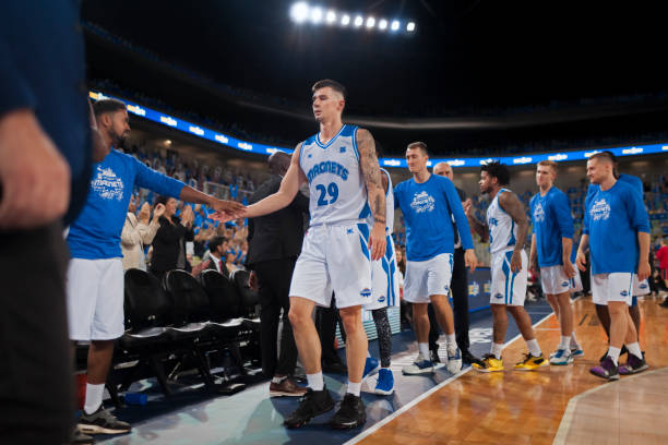istock Basketball players shaking hands with coaches 1216206684