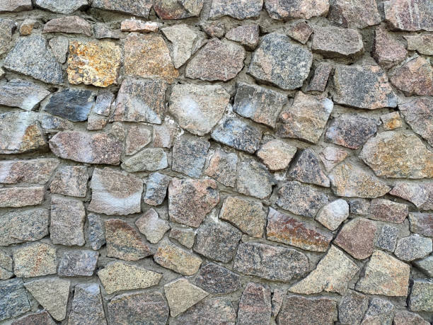 istock Background of large stones wall texture with different colors 1216207031