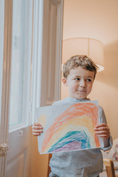 istock Young Boy showing his drawing on home during the Covid-19 crisis 1216207493