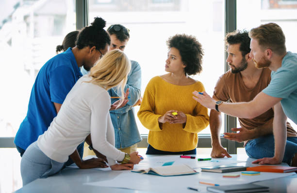 istock Group of young designers at a studio. 1216207671