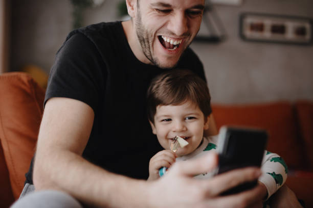 istock Father and son connect with family during quarantine 1216207828