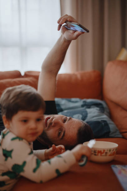 istock Father and son connect with family during quarantine 1216208553