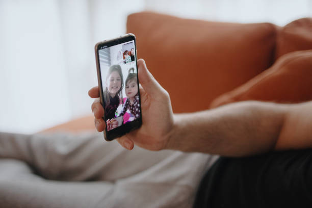istock Father and son connect with family during quarantine 1216208702