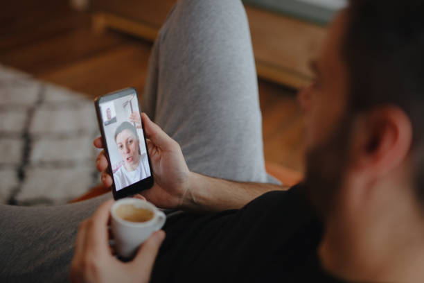 istock Man using video call to connect with family during quarantine 1216208798