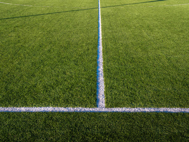 istock Intersection of center and side line on a soccer field 1216208984