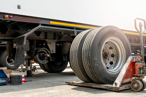 truck spare wheels ,tire waiting for to change, trailer wheels maintenance