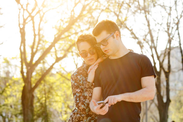 istock Modern urban couple posing in the park. 1216209398