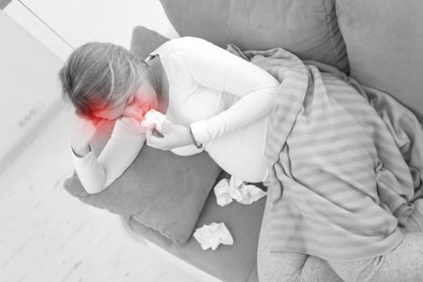 istock Pregnant tired exhausted woman with head issues at home on a couch, being sick. 1216209574