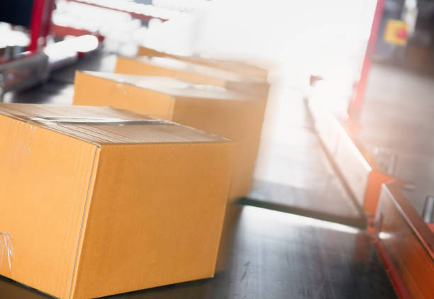 istock package boxes sorting on conveyor belt, export shipment goods, warehouse industry delivery service, logistics and transport. 1216210911