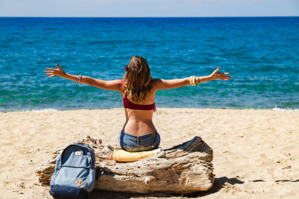 Woman enjoying on a sandy tropical beach.