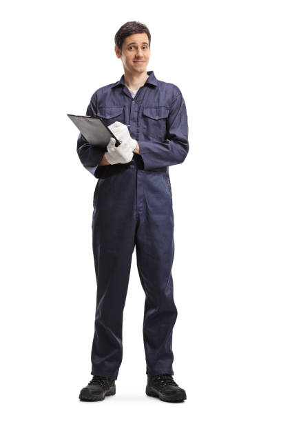 istock Male worker in a uniform holding a clipboard 1216212405