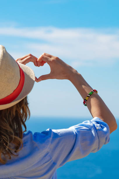 istock Woman in summertime with tropical ocean scenery. 1216212623