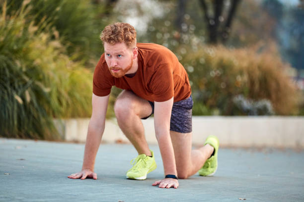 istock Young modern man jogging / exercising in an urban park. 1216212882
