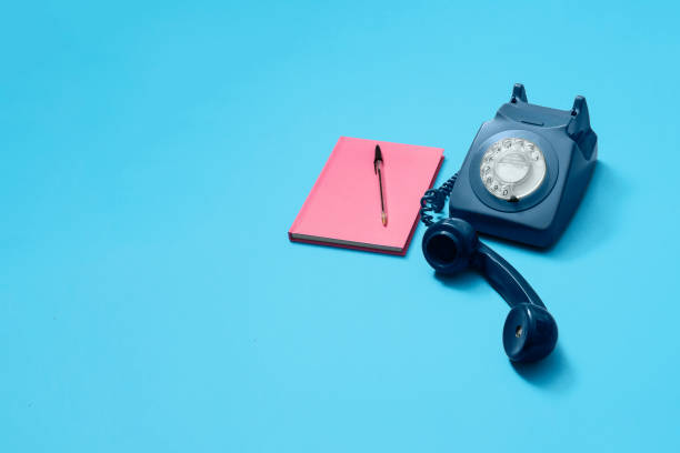 istock Blue vintage antique rotary phone on blue with copy space 1216213208