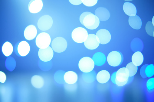 Abstract cold blue bokeh background.