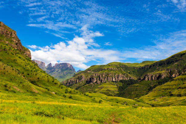 istock Green mountains and blue sky with some clouds 1216215799