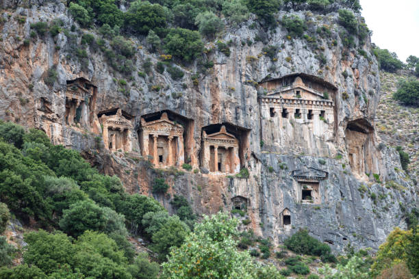 Ancient city of Kaunos, Dalyan valley, Turkey. Kaunos (Latin: Caunus) was a city of ancient Caria and in Anatolia, a few km west of the modern town of Dalyan, Muğla Province, Turkey.