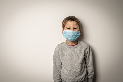 Cute little boy with medical mask on the face