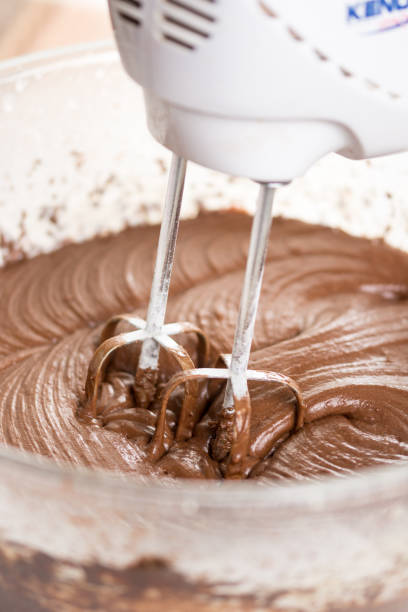 istock Mixing chocolate cream ganache with hand mixer 1216219192