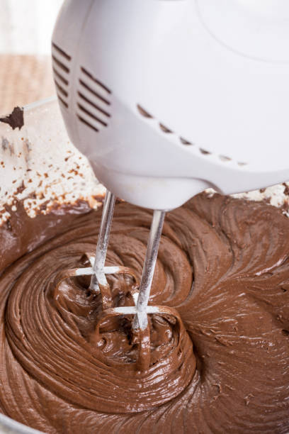 istock Mixing chocolate cream ganache with hand mixer 1216219308