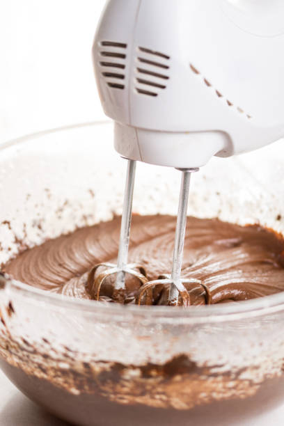 istock Mixing chocolate cream ganache with hand mixer 1216219316