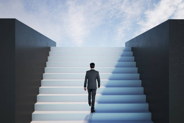istock Businessman walking on ladder to success 1216220538