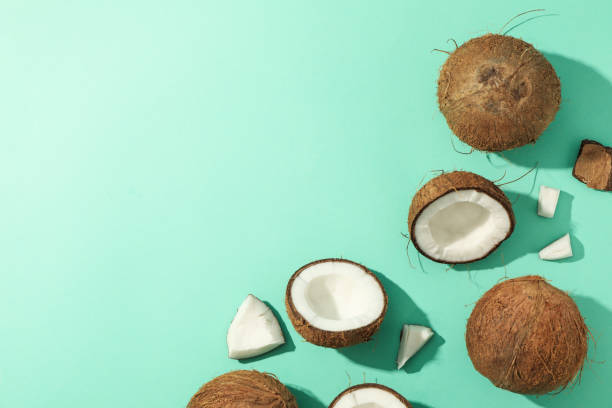 istock Flat lay with coconut on mint background, top view 1216221173