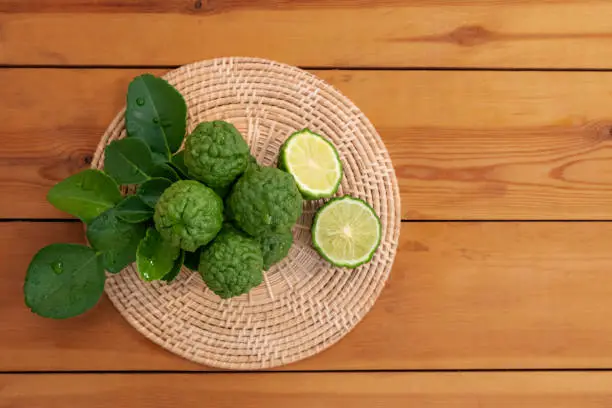 Photo of Fresh bergamot from nature Resting on a wooden chopping board To be used as a cook and nourish the skin.