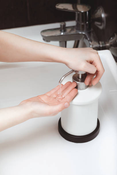 istock A child squeezes liquid soap from a dispenser 1216222492