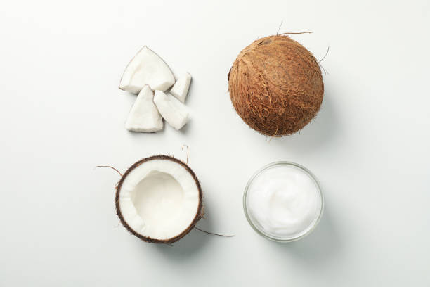 istock Flat lay with coconut and cosmetic on white background, top view 1216223433