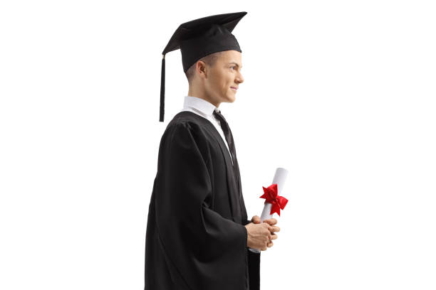 Male graduate clothing holding a diploma Male graduate clothing holding a diploma isolated on white background graduate profile photos stock pictures, royalty-free photos & images