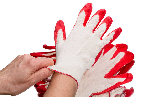 istock Trying on cotton gloves 1216223515
