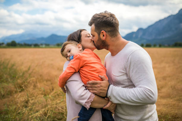 istock Happy young family in nature 1216224096